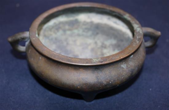 A Chinese brown patinated bronze ding censer, Xuande six character mark, probably 17th/18th century, width 21cm